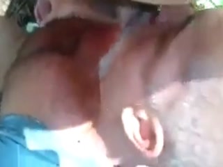 Daddy bear sucking cock in forest